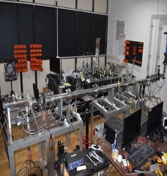 Laboratory bench with stainless-steel feed lines, valves, instrumentation and monitoring computers used for liquid engine work.